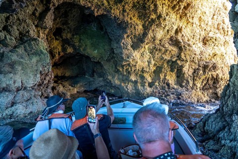 Tour with a small motorboat to the Ponta da Piedade rocky coast, rugged coastal landscape, right