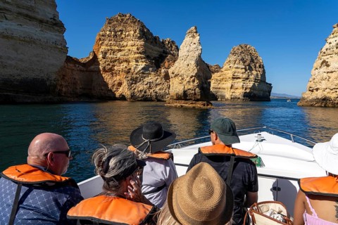 Tour with a small motorboat to the Ponta da Piedade rocky coast, rugged coastal landscape, right