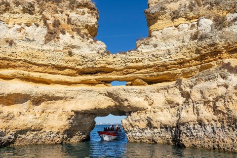 Tour with a small motorboat to the Ponta da Piedade rocky coast, rugged coastal landscape, right