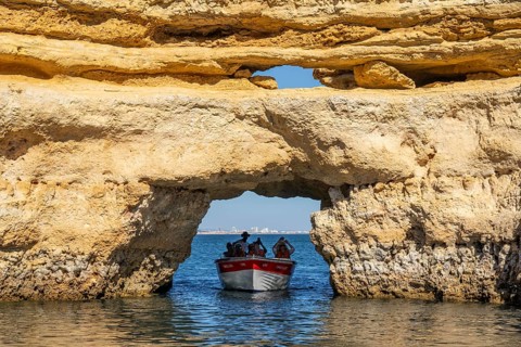 Tour with a small motorboat to the Ponta da Piedade rocky coast, rugged coastal landscape, right