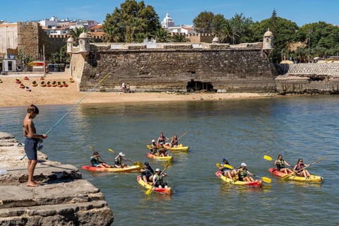Kayak tours to the rocky coast Ponta da Piedade, groups of tourists in kayaks on the sea to the