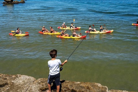 Kayak tours to the rocky coast of Ponta da Piedade, groups of tourists in kayaks on the sea to the