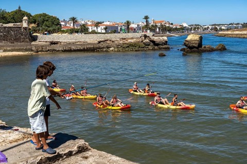 Kayak tours to the rocky coast of Ponta da Piedade, groups of tourists in kayaks on the sea to the