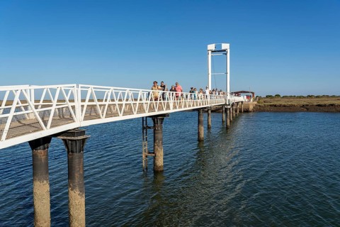 Bridge over the lagoon to the kilometre-long sandy beach Praia do Barril, on the island off Santa