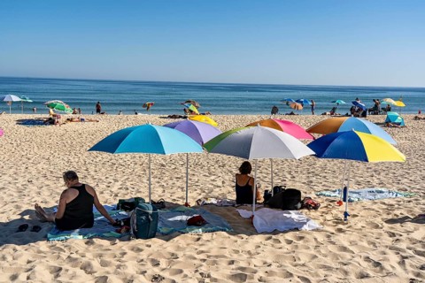 Kilometre-long sandy beach Praia do Barril, on the island off Santa Luzia, Algarve, Portugal