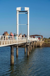 Bridge over the lagoon to the kilometre-long sandy beach Praia do Barril, on the island off Santa