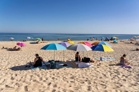 Kilometre-long sandy beach Praia do Barril, on the island off Santa Luzia, Algarve, Portugal