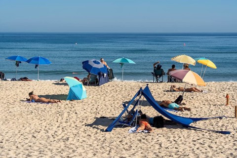 Kilometre-long sandy beach Praia do Barril, on the island off Santa Luzia, Algarve, Portugal
