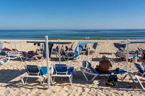 Kilometre-long sandy beach Praia do Barril, on the island off Santa Luzia, Algarve, Portugal