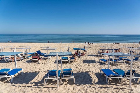 Kilometre-long sandy beach Praia do Barril, on the island off Santa Luzia, Algarve, Portugal