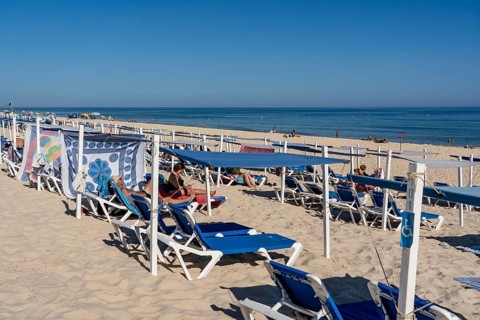 Kilometre-long sandy beach Praia do Barril, on the island off Santa Luzia, Algarve, Portugal