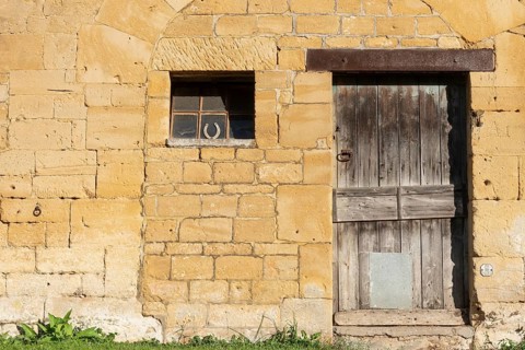 Wooden door, window, historic house facade, yellow sandstone, Marville, Renaissance village,