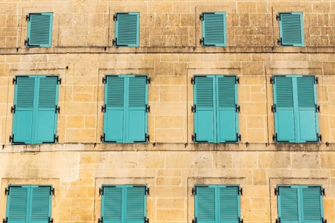 Closed, green shutters, historic house façade, yellow sandstone, Marville, Renaissance village,