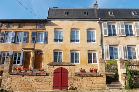 Renovated house facade, historic building, yellow sandstone, Marville, Renaissance village,