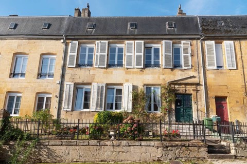 Renovated house facade, historic building, yellow sandstone, Marville, Renaissance village,