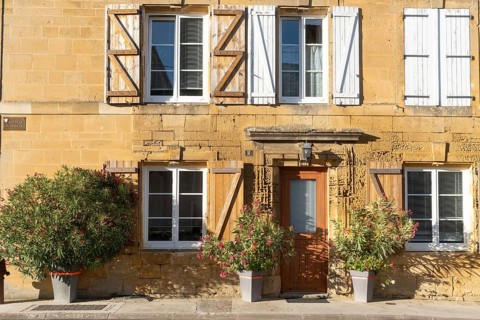 Renovated building, historic house façade, yellow sandstone, Marville, Renaissance village,