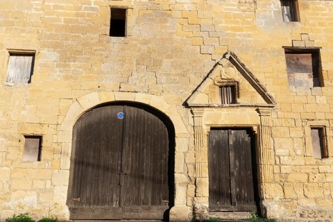 Wooden door, window, historic house facade, yellow sandstone, Marville, Renaissance village,