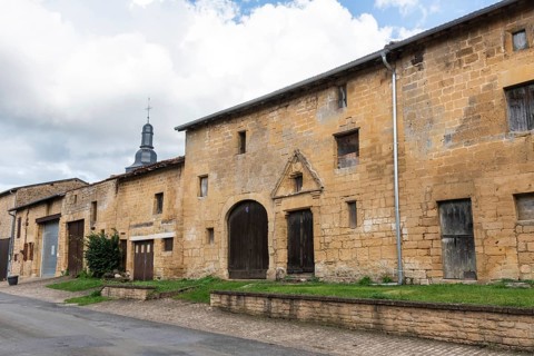 Abandoned street with historic house facades, yellow sandstone, Marville, Renaissance village,