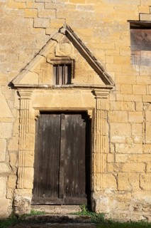 Wooden door, historic house façade, yellow sandstone, Marville, Renaissance village, Département