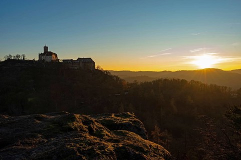 View of Wartburg Castle with the setting sun and the Thuringian Forest, Eisenach, Thuringia,