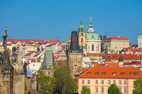 Famous Charles Bridge on Vltava River and beautiful buildings of the old town of Prague, Czech