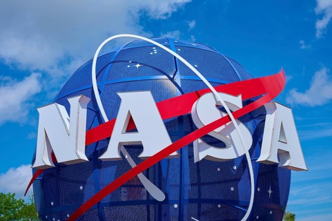 NASA logo in front of a blue, cloudy sky, Kennedy Space Centre Visitor Complex, Merritt Island,