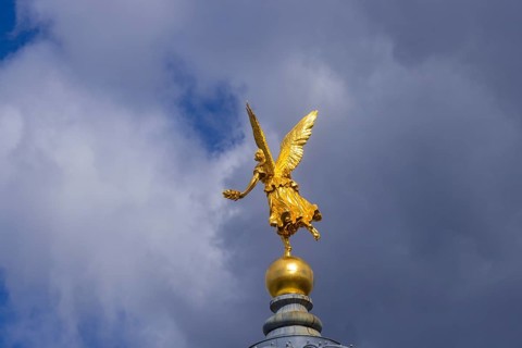Fama (the goddess of rumours) on the dome of the Academy of Fine Arts, Dresden, Saxony, Germany