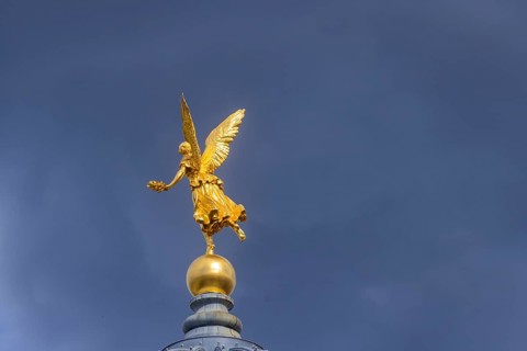 Fama (the goddess of rumours) on the dome of the Academy of Fine Arts, Dresden, Saxony, Germany
