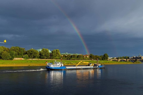 Dredger Domarin with rainbow over the Elbe at Neustädter Elbufer, Dresden, Saxony, Germany
