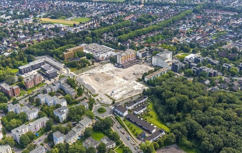 Aerial view, town hall and town hall square as well as construction site with demolition of the
