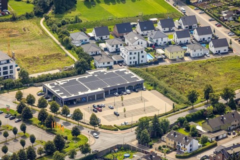 Aerial view, Aldi supermarket with solar roof and new housing estate Büscherstrasse in Bergkamen,