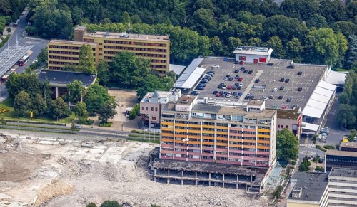 Aerial view, town hall and town hall square as well as construction site with demolition of the