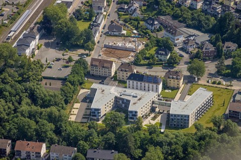 Aerial view, construction site and new building care centre, building complex for assisted living,