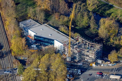 Aerial view, construction site with extension Eglo Leuchten Handels GmbH in the district Neheim in