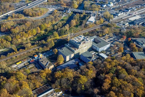 Aerial view, construction site and new building at the Berufskolleg Berliner Platz in the district