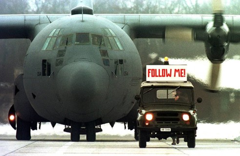 HUN, Karposvar, 01.12.1995 -- An American military aircraft is guided by a Hungarian military jeep