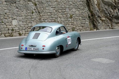 No. 213, Porsche 356 1100 Coupé, model year 1951, Blue vintage car drives past rocks on a winding