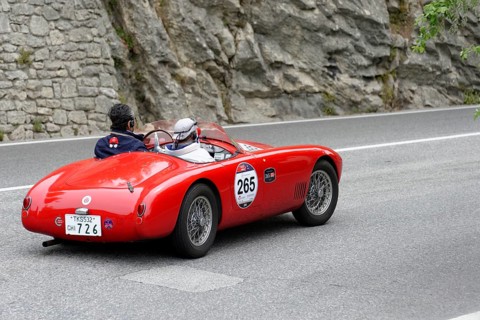 No. 265, O.S.C.A. MTA 1500 2AD, year of construction 1953, red vintage car driving on a road with
