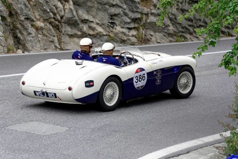 No. 386, Austin Healey 100 S, built in 1955, white classic car convertible travelling on a winding