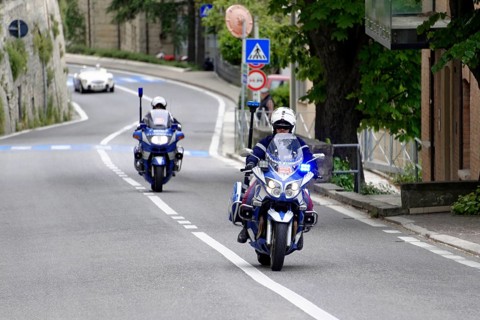 Police motorbikes driving on a road, accompanied by traffic signs, Mille Miglia 2014 or 1000