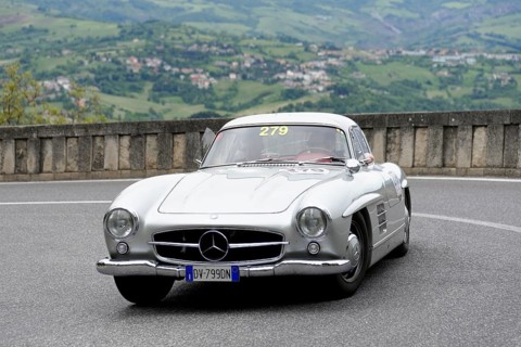 No.279, Mercedes-Benz 300 SL W 198, model year 1954, Silver vintage car driving on a winding road