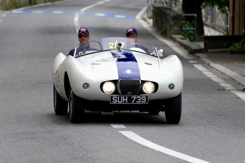 No. 287, Arnolt Bristol Bolide, built in 1954, A white vintage convertible with a blue stripe is