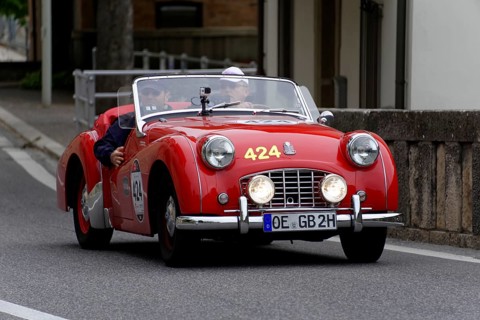 No.424, Triumph TR 3 Sports, built in 1956, A red vintage convertible with two people and round