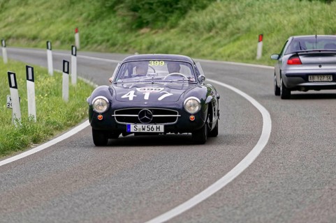 Black Mercedes classic car on a winding country road during a race, classic car, car race, Mille