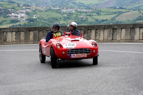 Stanguellini 1100 Sport, built in 1948, red vintage sports car with two occupants on a winding