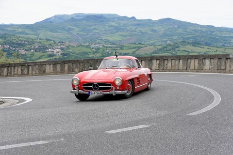 No. 334, Mercedes-Benz 300 SL W 198, model year 1955, Red classic sports car rounding the bend in a