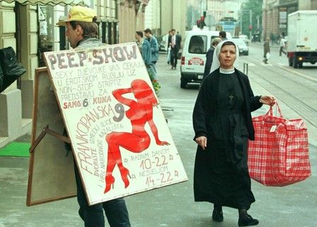 HRV, Zagreb, 01.05.1995 -- A Catholic nun meets a sex shop advertiser in Zagreb. -- A catholic now
