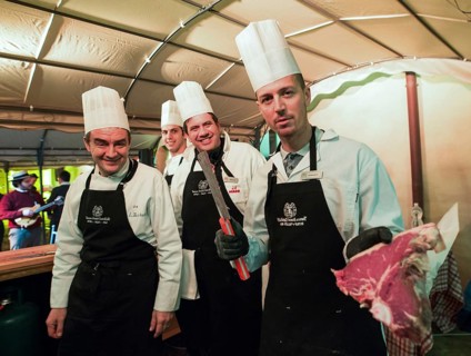 ITA Italy Castelfalfi chefs show the quality of meat during a meeting for tourism managers
