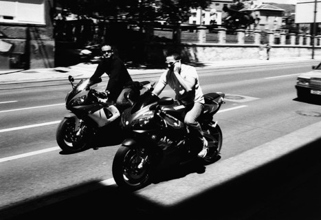 BIH, Bosnia, Sarajevo, 22.07.2005, motorcyclist without helmet with cellphone and sunglasses