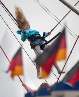 DEU Germany Berlin girls jumping on trampolines. Scene on the eve of the 20th anniversary of German